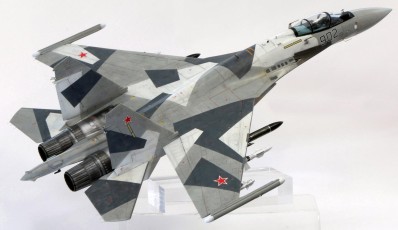 A 1/32 scale model of a Sukhoi Su-35 fighter jet.